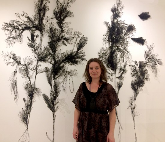 Sofia Björkman in front of her wall installation What has the bird done?